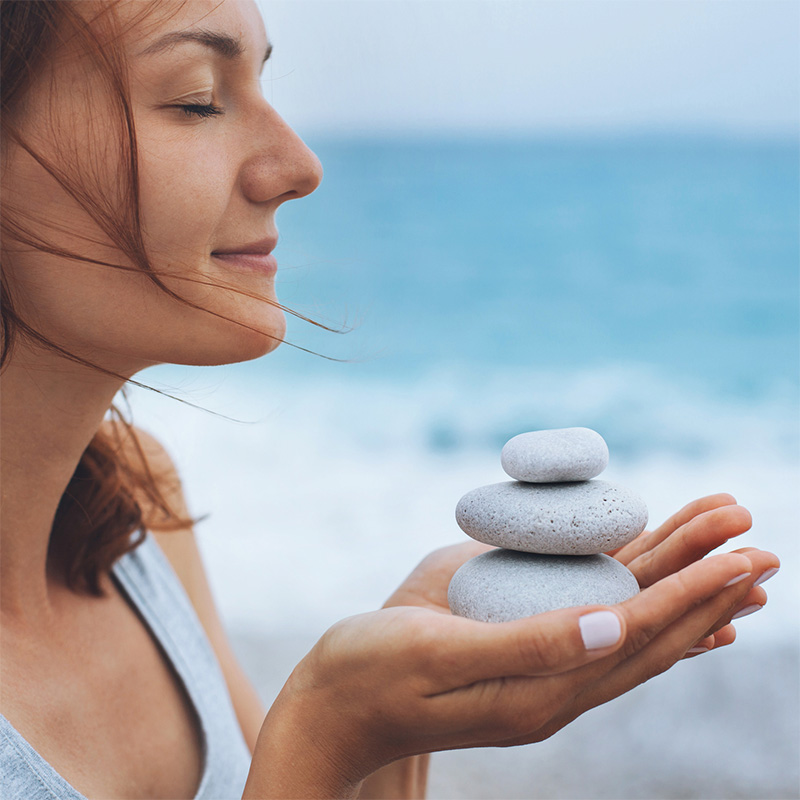 Woman with balanced stones