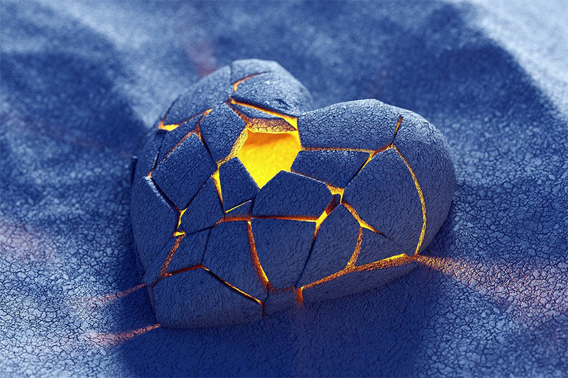 Image of cracked heart with light bursting out