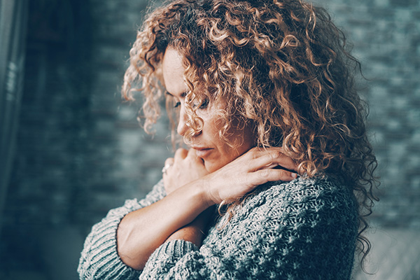 Woman embracing herself