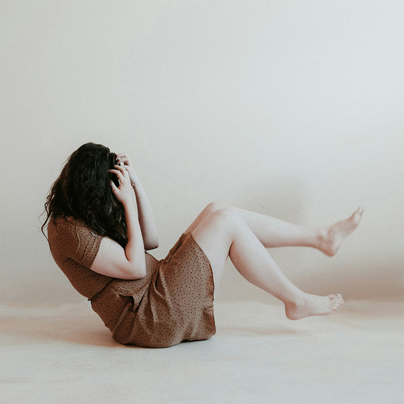 Woman holding her head